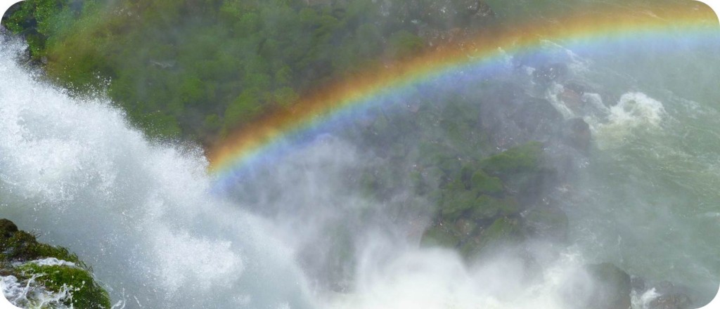 A rainbow over a waterfall
